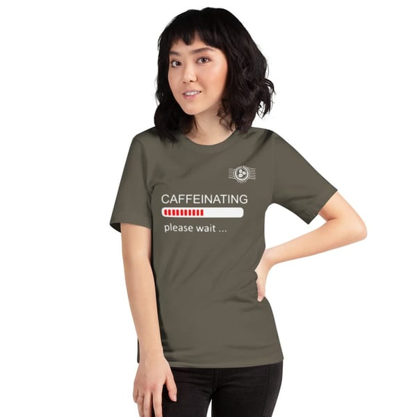 Woman in a World Blend Coffee t-shirt that says "CAFFEINATING please wait..."